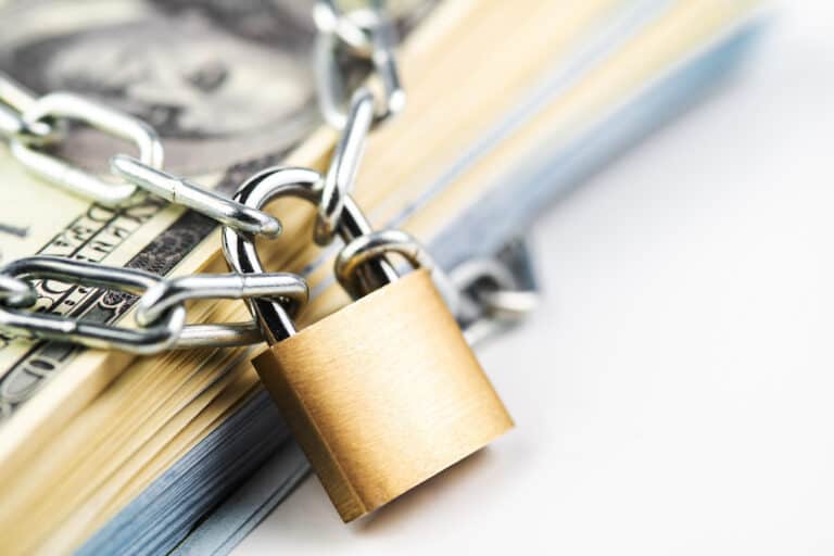 Money with lock, representing how AB 1101 insures and protects HOA funds.