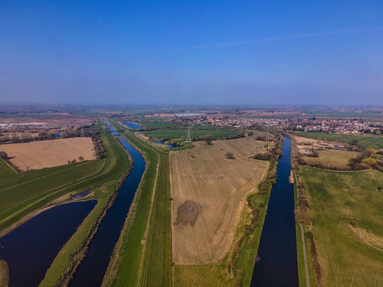 image of irrigation canals running through farm land